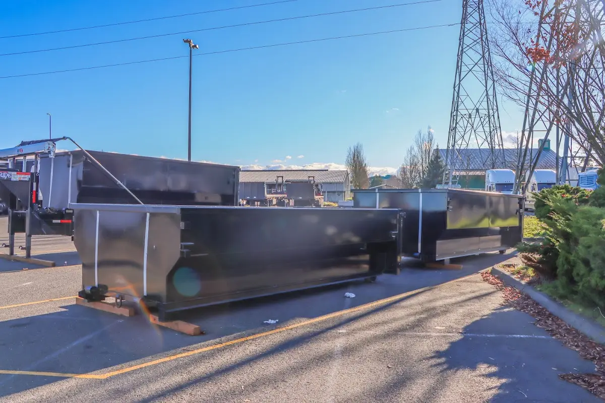 Roll-off dumpster ready for waste disposal at job site for Concrete Dumpster Rental in Milton